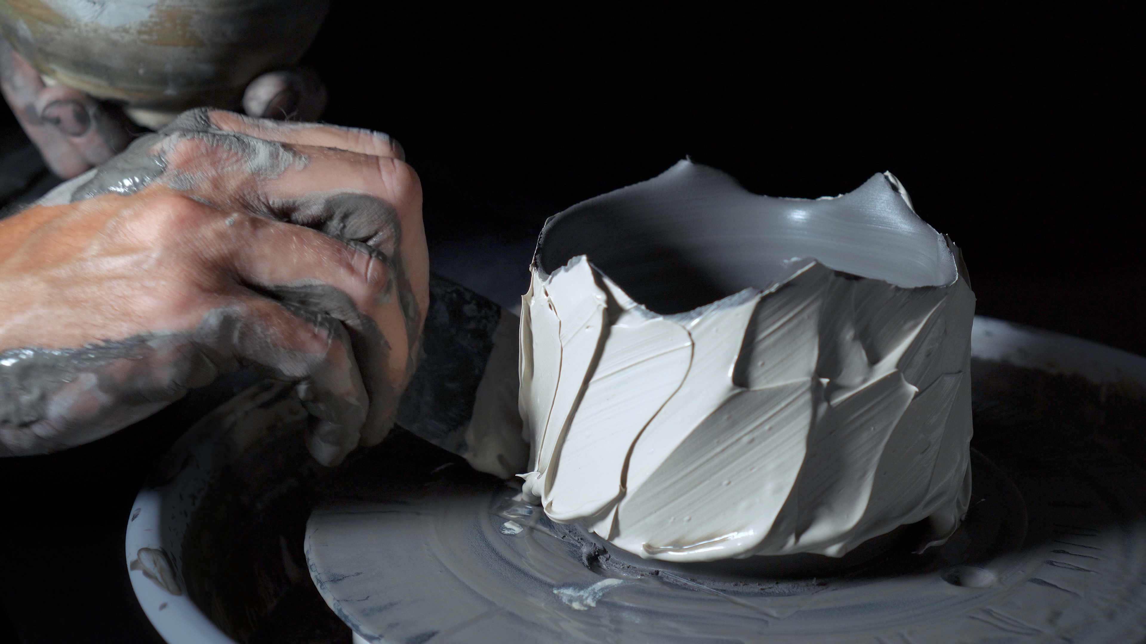 Applying slip to a hand-thrown vessel