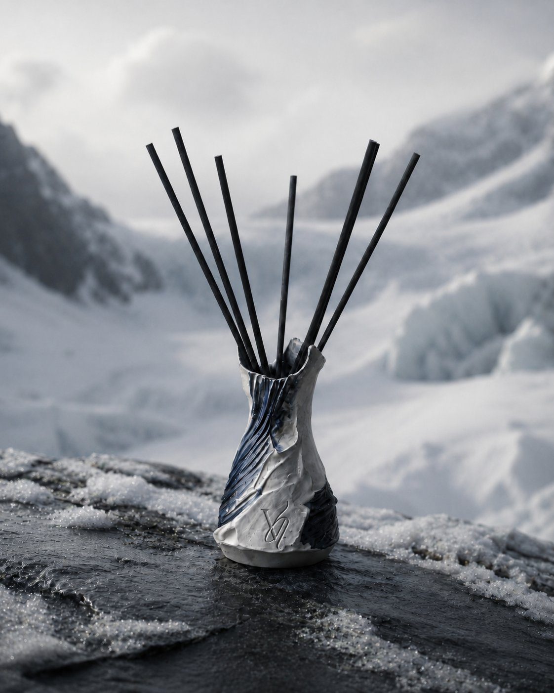Altitude — a Valdaire vessel against bare rock and snow light
