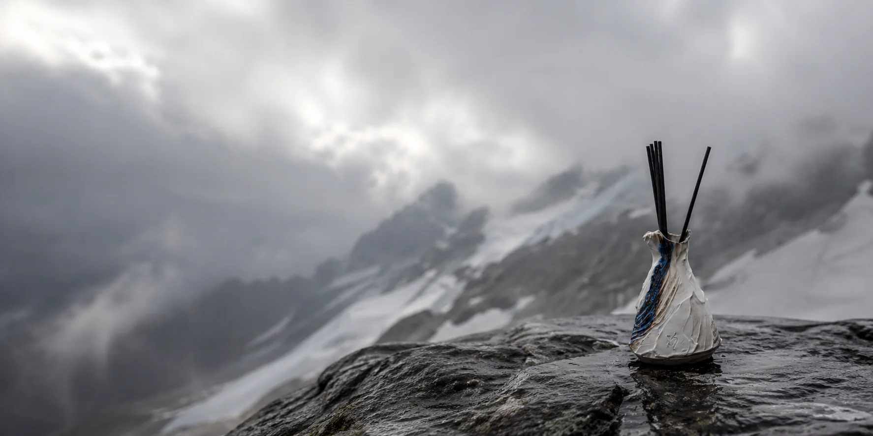 A Valdaire vessel against bare rock and snow light